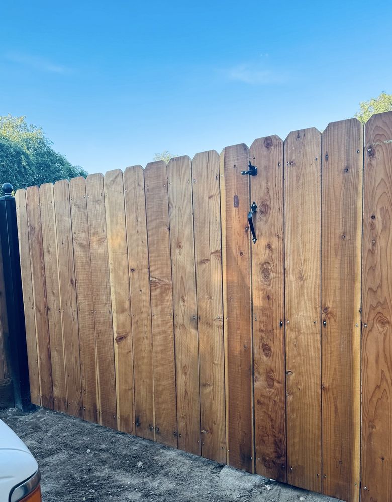 Professional technician repairing an electric gate