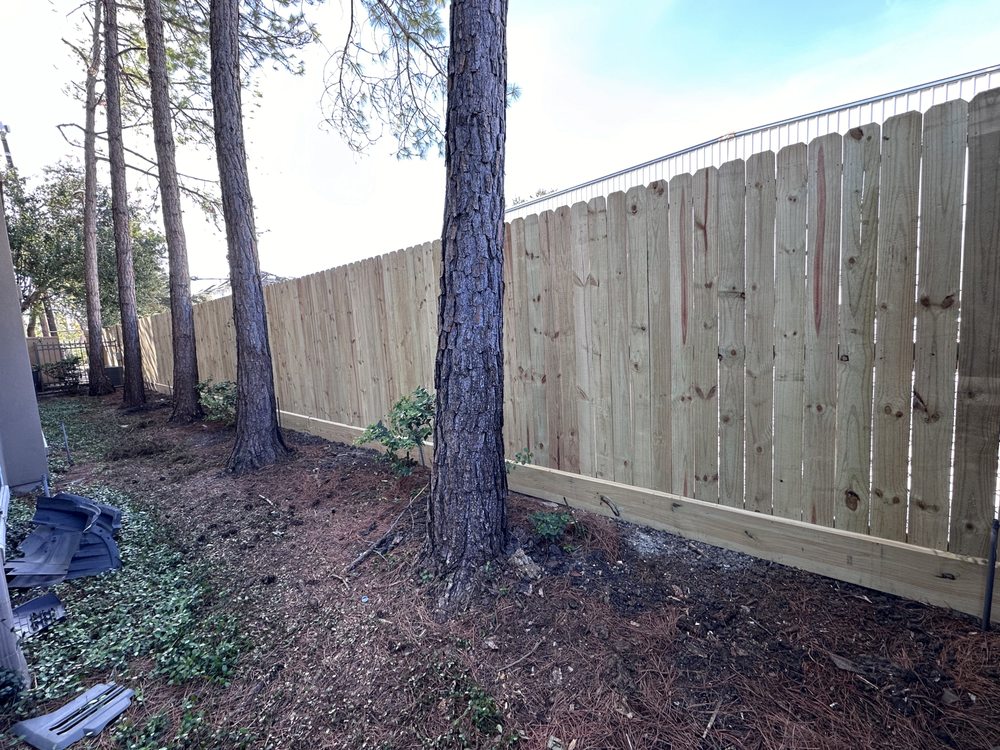 Electric gate repair service technician working on a gate motor
