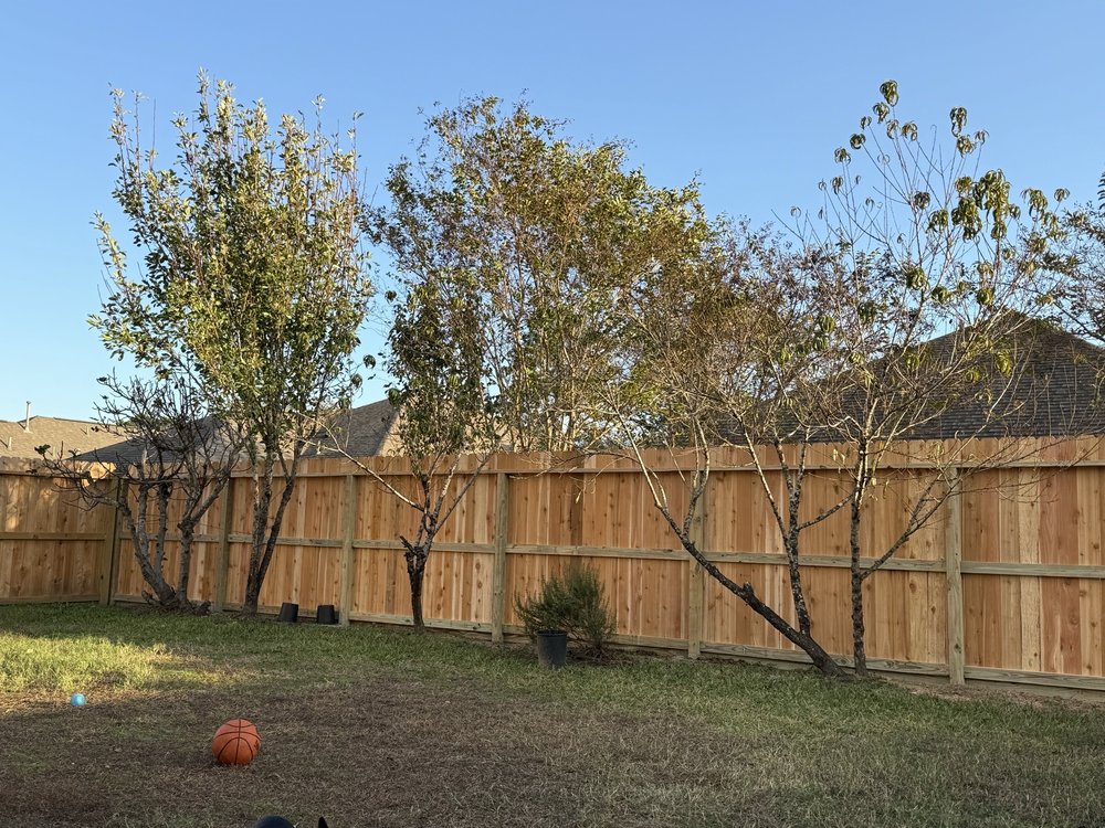 Electric gate repair service technician fixing a gate