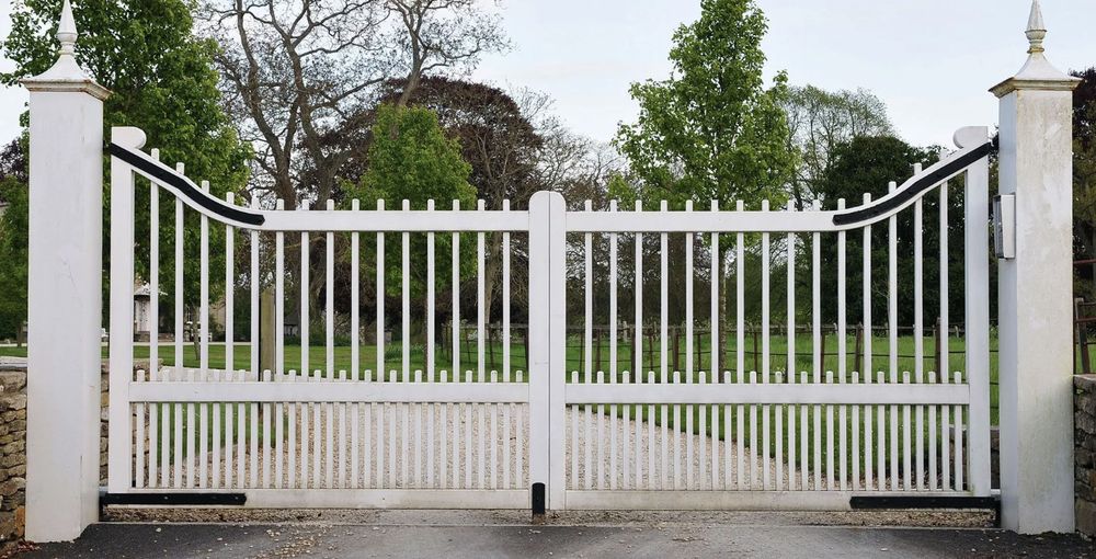 Professional technician repairing an electric gate